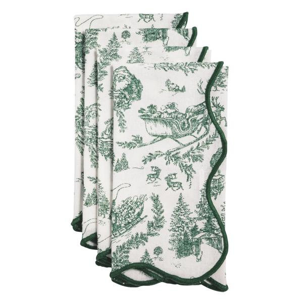 Set of four white cotton dinner napkins with green Christmas toile pattern and scalloped edges.