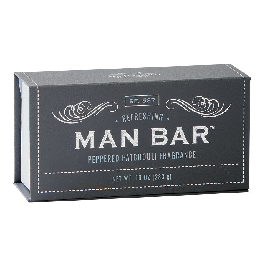 Man Bar soap bar in peppered patchouli scent with a textured surface.