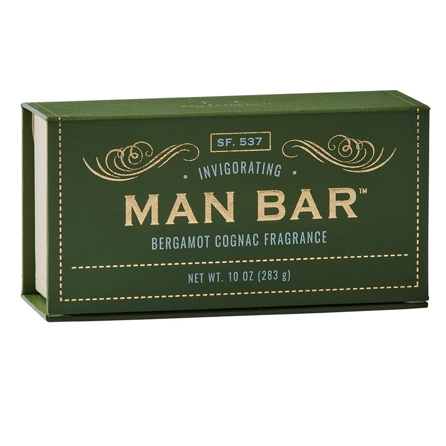 Man Bar soap bar in light beige with a subtle embossed logo on the top surface.