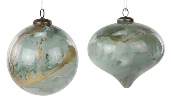 Sage green marble-patterned glass ornament with a spherical shape.