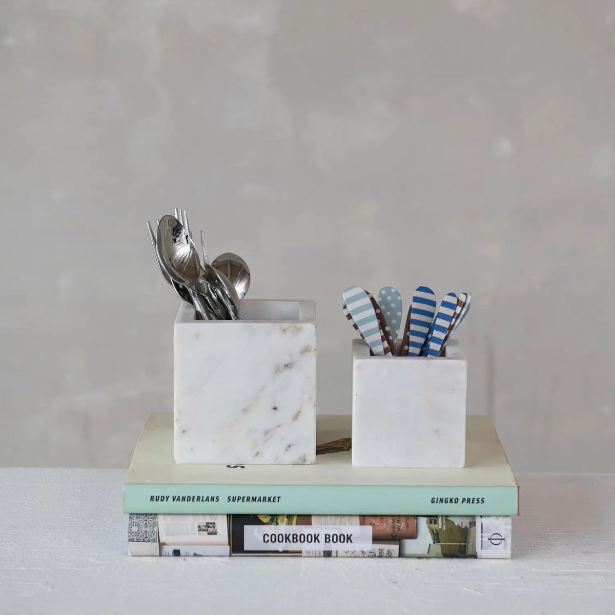 White marble square container with a sleek cube shape.