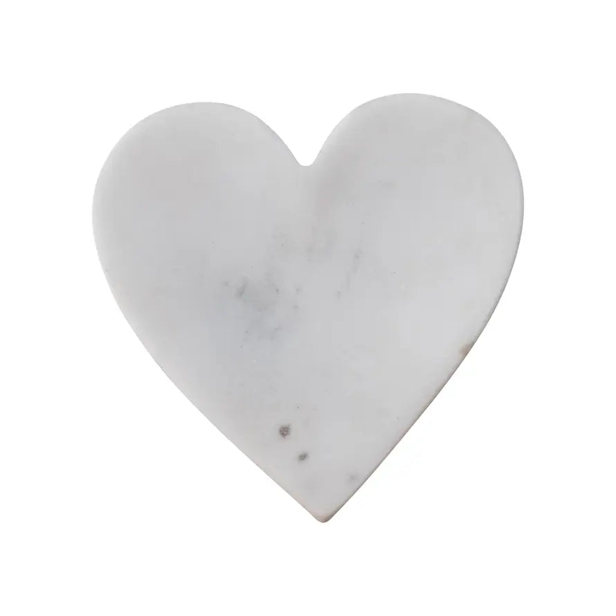 Heart-shaped marble decorative dish with a smooth carved surface.
