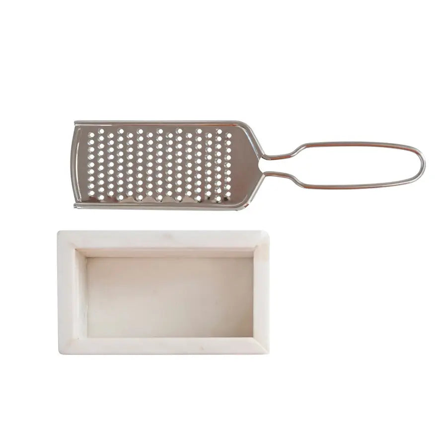 Stainless steel cheese grater with white marble base