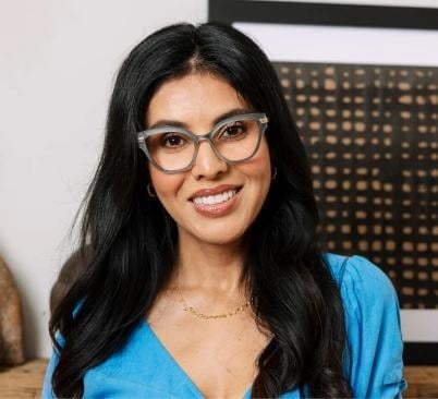 Marquee eyeglasses with matte textured front, quartz-inspired temples, gold hinge wraparound, and blue light focus lenses.