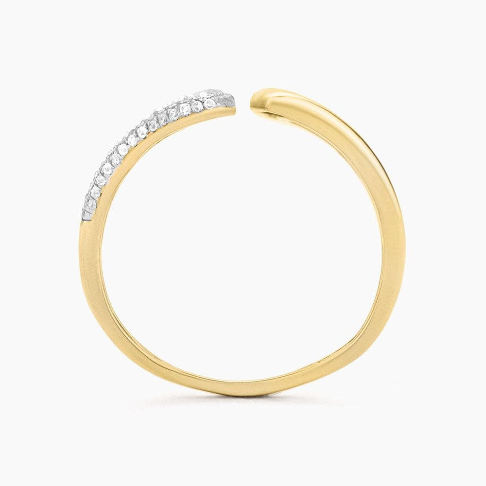 Gold statement ring featuring a masquerade mask design with diamond accents.