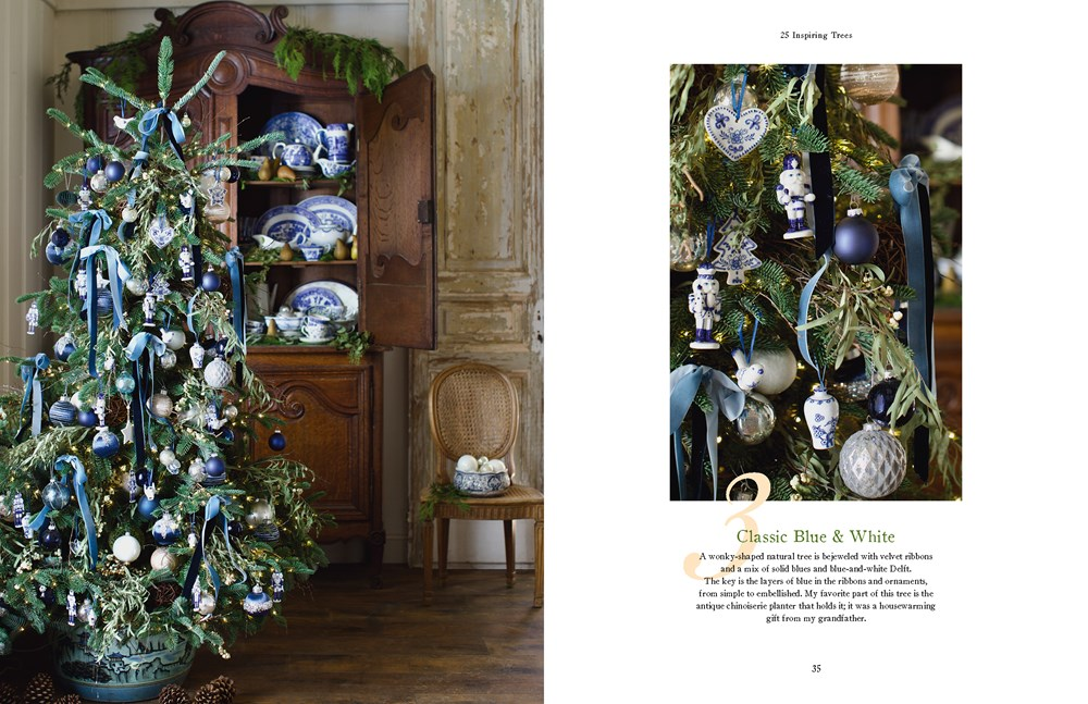 Open pages of French Country Cottage Christmas book showing a blue and white themed Christmas tree.