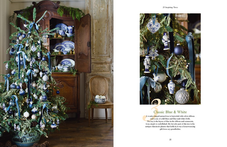 Open pages of French Country Cottage Christmas book showing a blue and white themed Christmas tree.