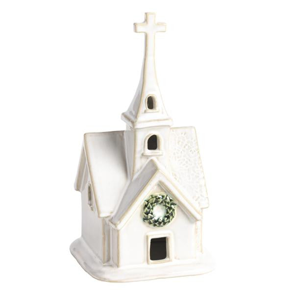 White ceramic church sitter with a cross, pressed lace texture, and a green wreath detail.