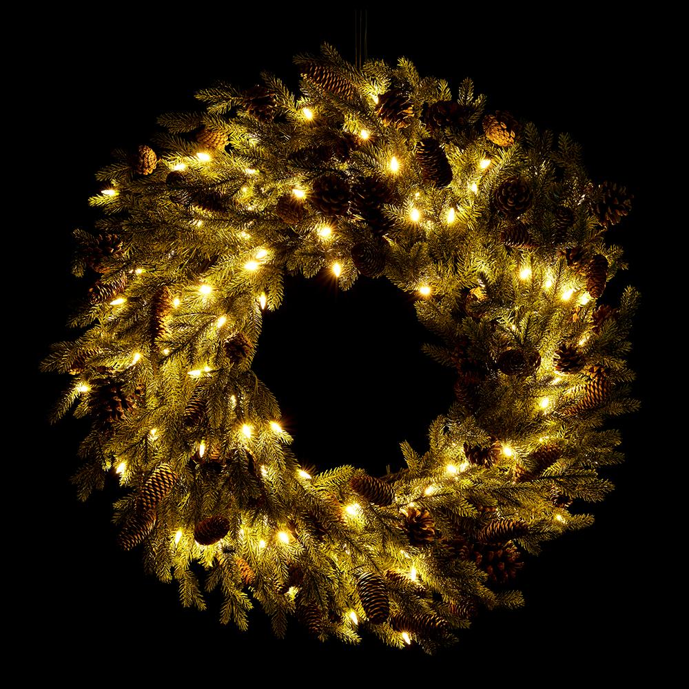 32-inch spruce and pine cone wreath with 150 warm LED lights on a black background.