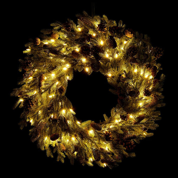 32-inch spruce and pine cone wreath with 150 warm LED lights on a black background.