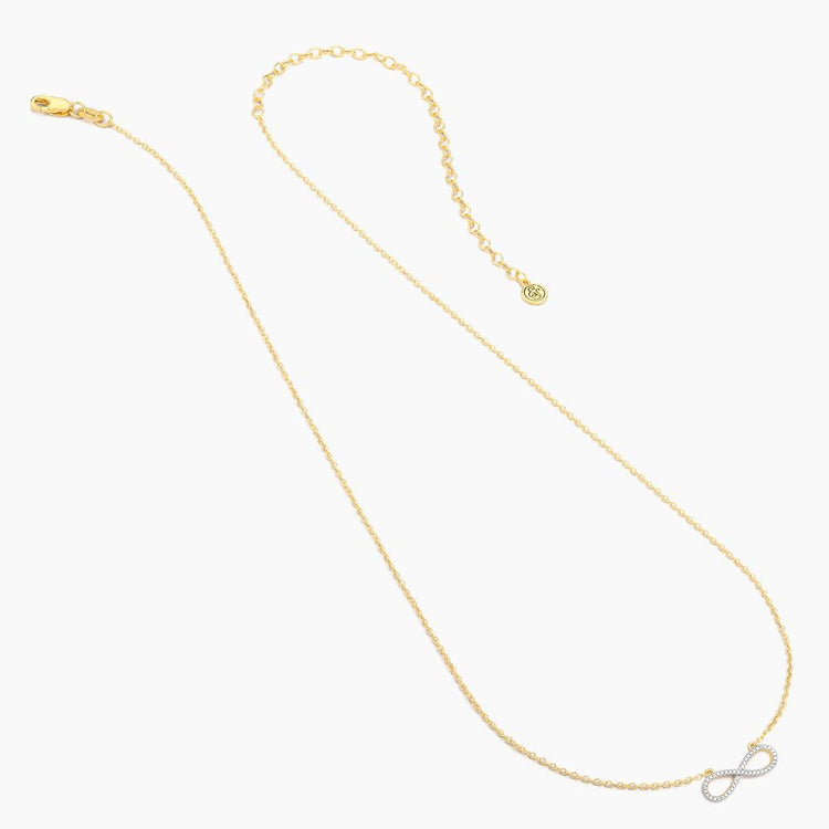 Live Limitless Pendant Necklace with a gold chain and diamond-encrusted infinity symbol pendant.