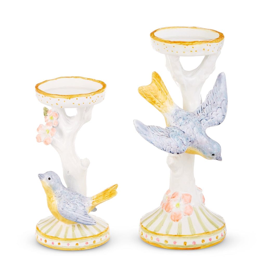Polyresin bird candle holder with a natural finish holding up to three-inch pillar candles.
