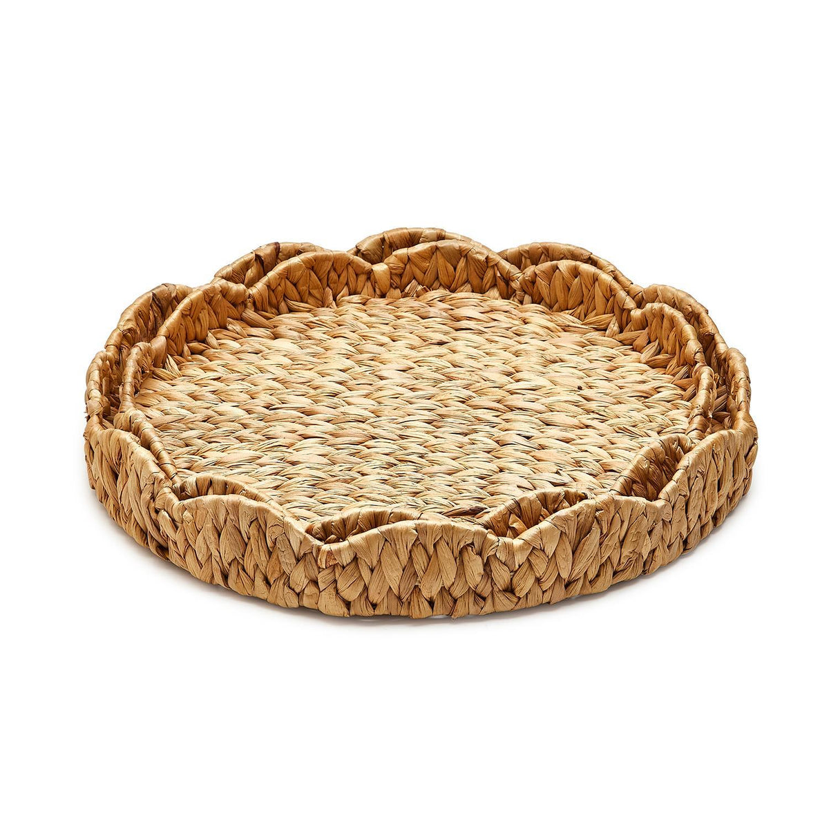 Round scalloped-edge tray made from natural water hyacinth with a light brown woven texture.