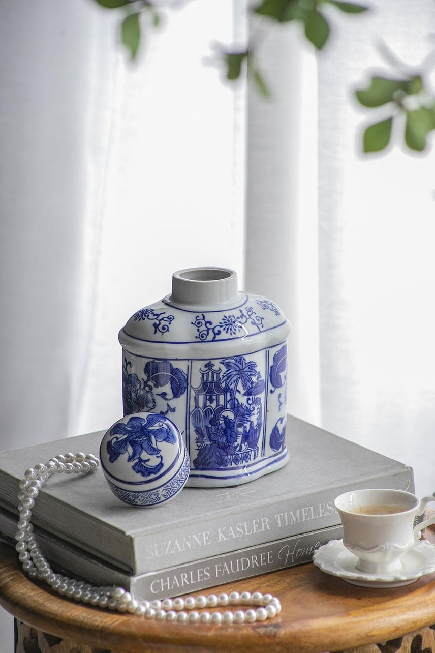 Oval porcelain jar in blue and white with a classic floral pattern.