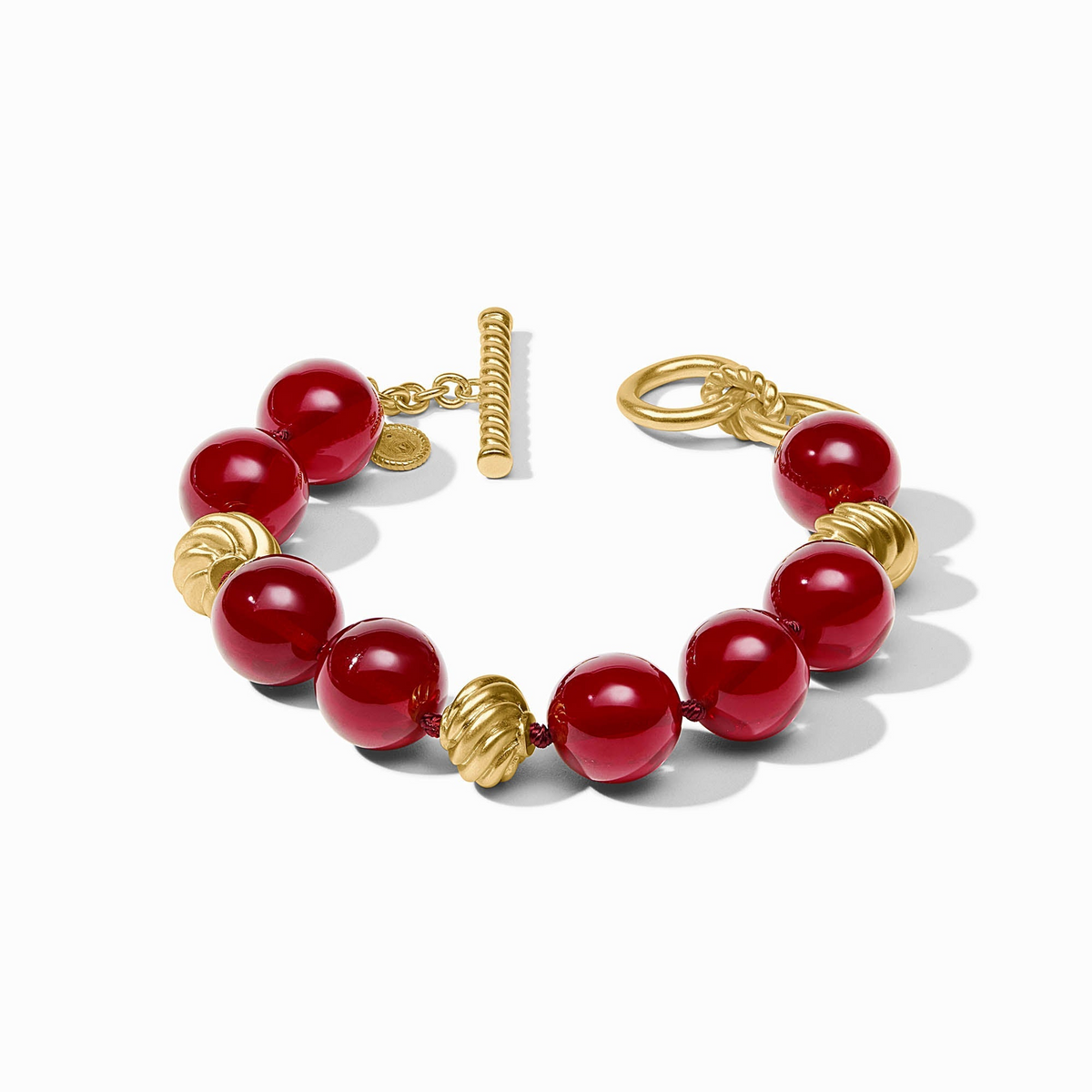 Ravello Bracelet with red resin beads and 24K gold-plated accents featuring a toggle closure.