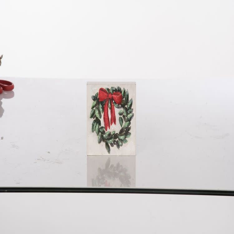 Hand-painted MDF wreath block decor with a festive circular pattern on a square silhouette.