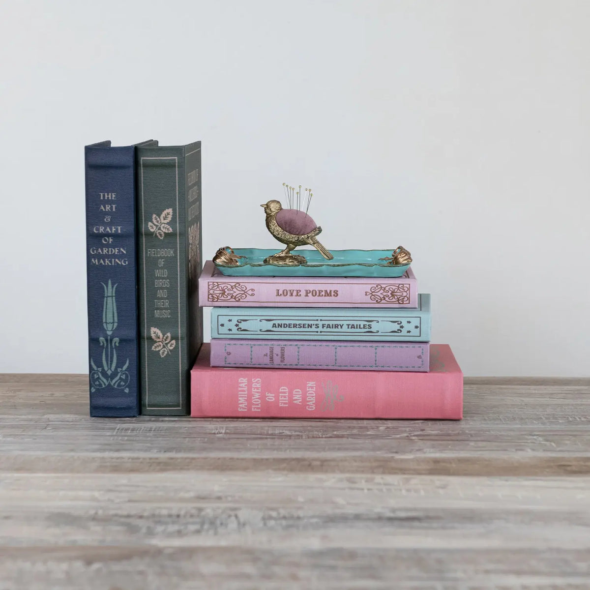 MDF book storage unit with linen front panels in a sleek cube shape.