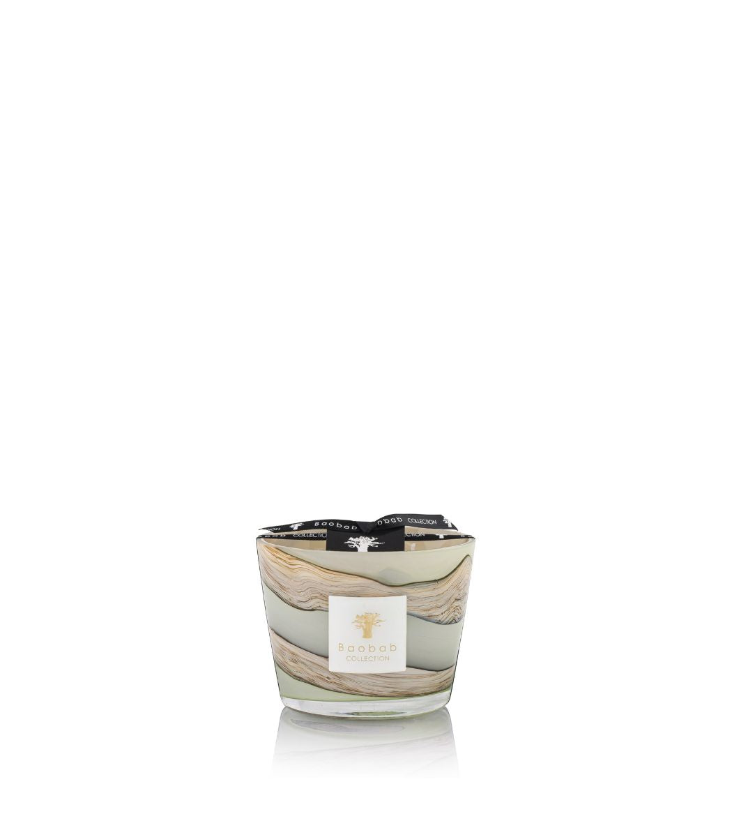 Glass candle vessel with organic celadon green to blue-gray wax lines featuring saffron and myrrh fragrance notes.