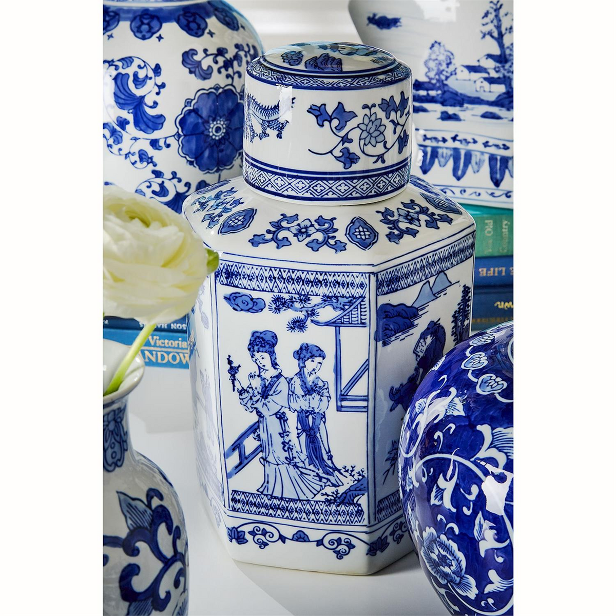 A collection of blue and white Canton ceramic jars and vases with traditional Chinese patterns.