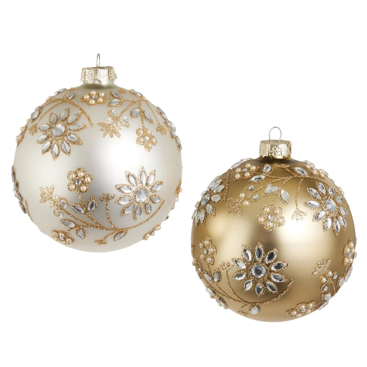 Two 5-inch glass ball ornaments in cream and gold with floral jewel and glitter accents.