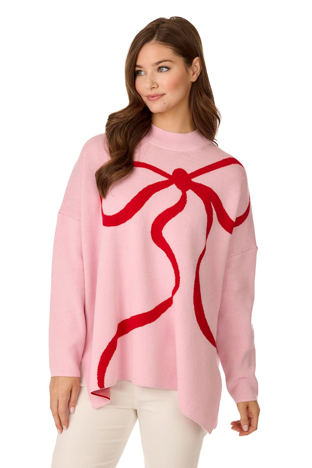 Woman wearing a pink Valentine's Jacquard Sweater with a large red bow graphic on the front.