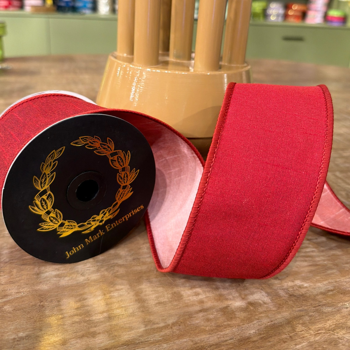 2.5 inch wide red Dupion double fused currant ribbon on a spool by John Mark Enterprises.