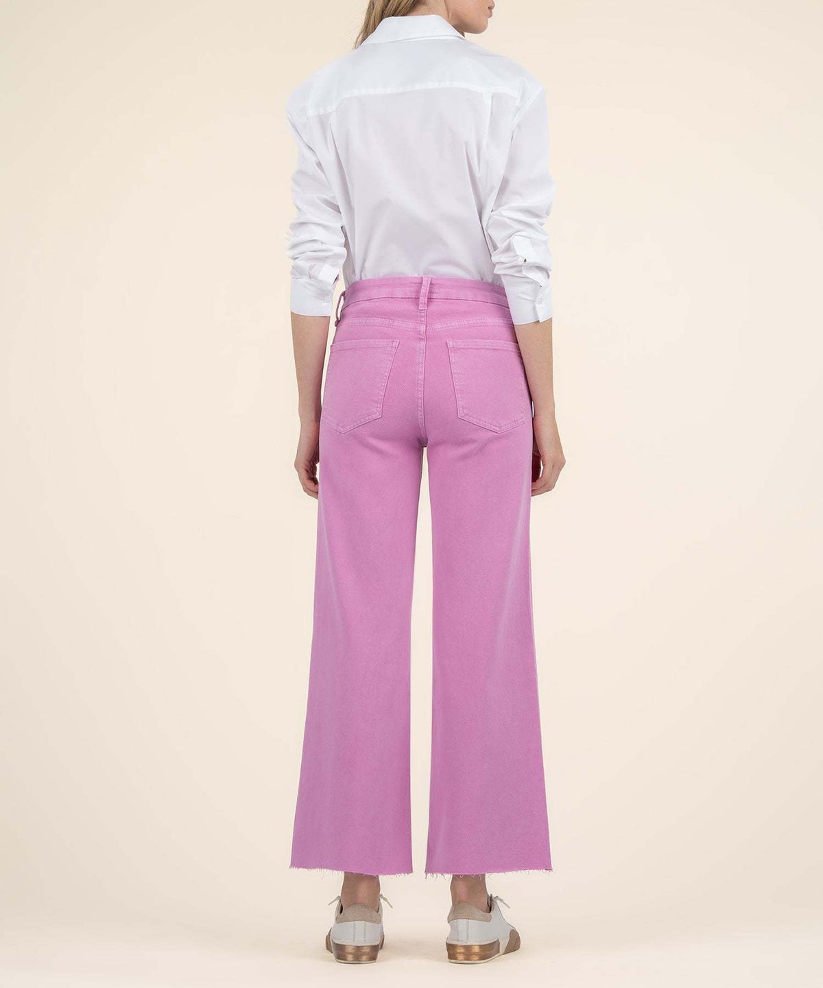 Back view of peony pink Meg high-rise wide-leg jeans with Fab Ab front pockets and a faded vintage wash.
