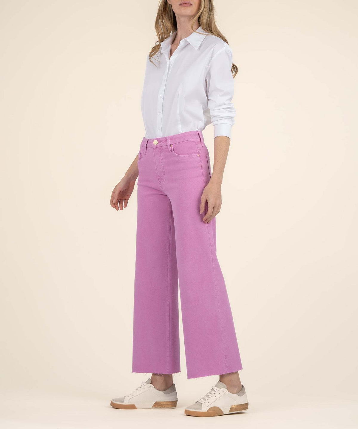 Side view of peony pink high-rise wide-leg jeans with front pockets