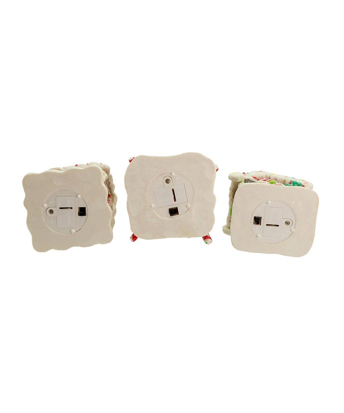 Clay gingerbread house ornament with glitter dusting and battery-operated LED lights.