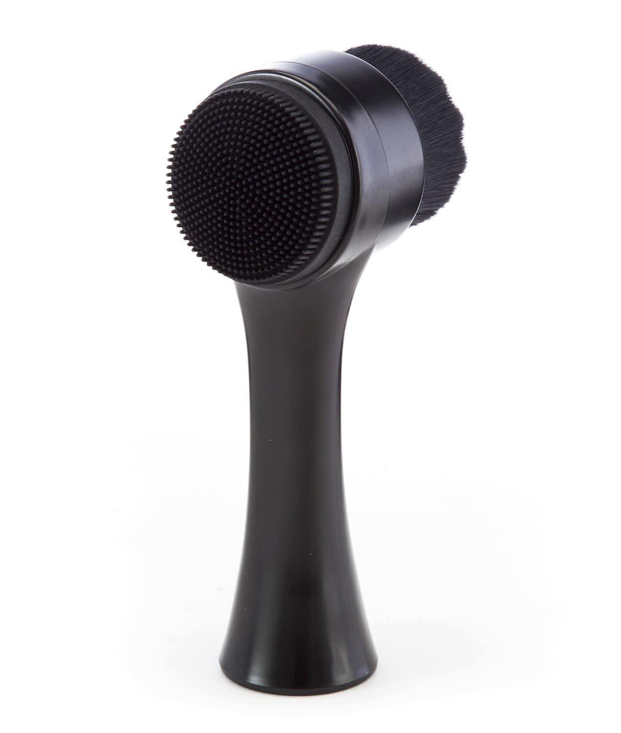 Men's facial cleansing brush with nylon bristles in a compact black handle.
