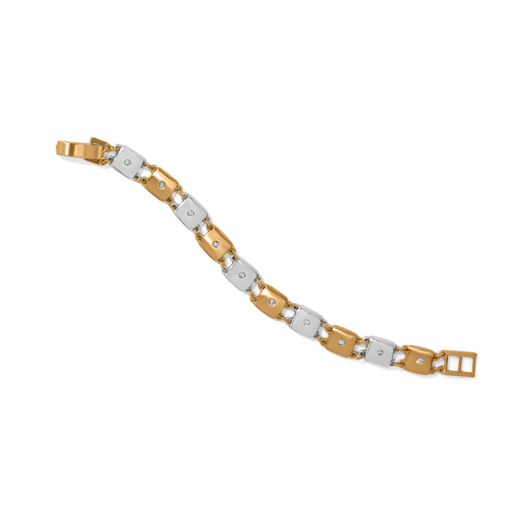 Adjustable two-tone silver and gold bracelet featuring fine quality crystals with a fold-over clasp.