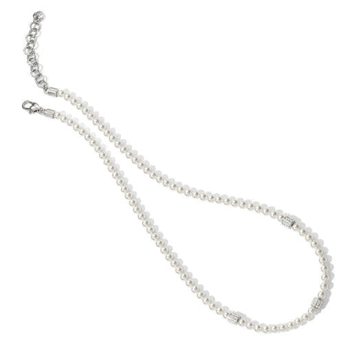 Silver-plated necklace with crystal pearl beads in a petite station motif on an adjustable chain.
