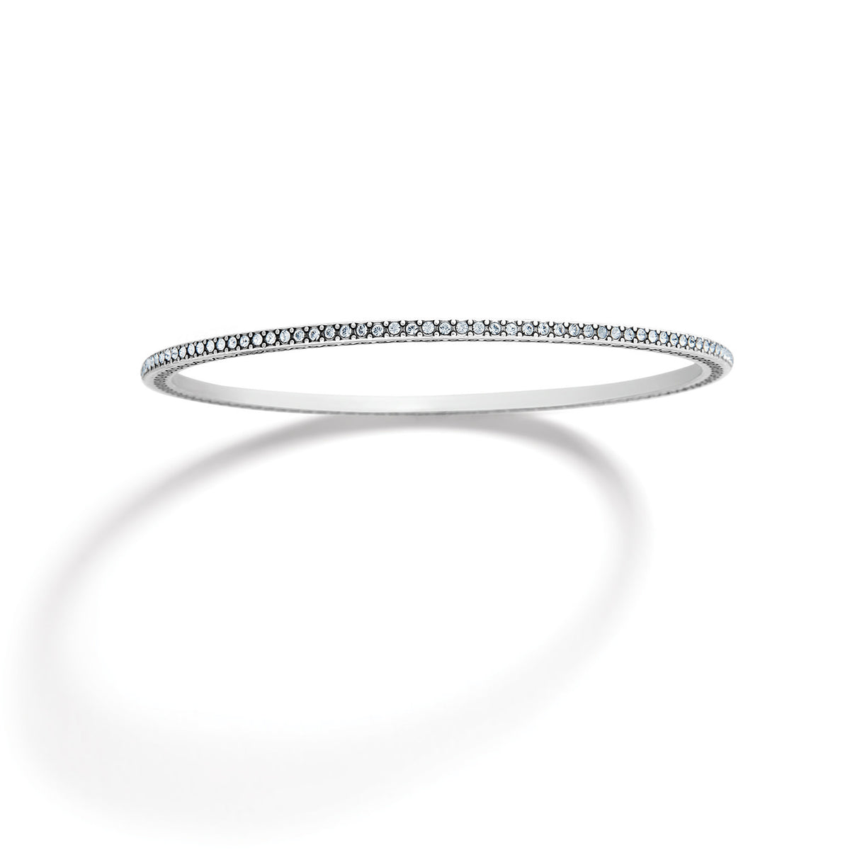 Silver plated thin bangle with fine crystal pave details on a silver background.
