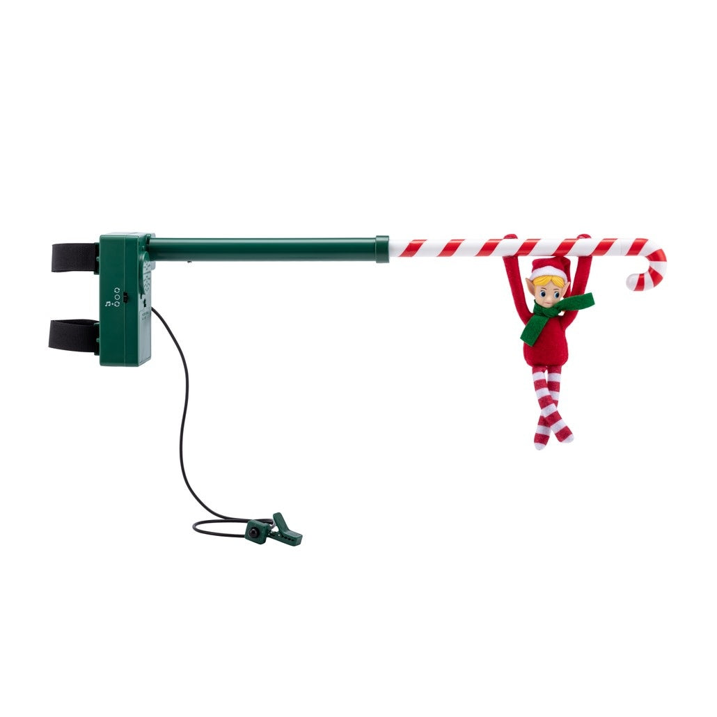 Mr. Christmas Acrobat elf figurine with poseable limbs circling a candy cane pole.