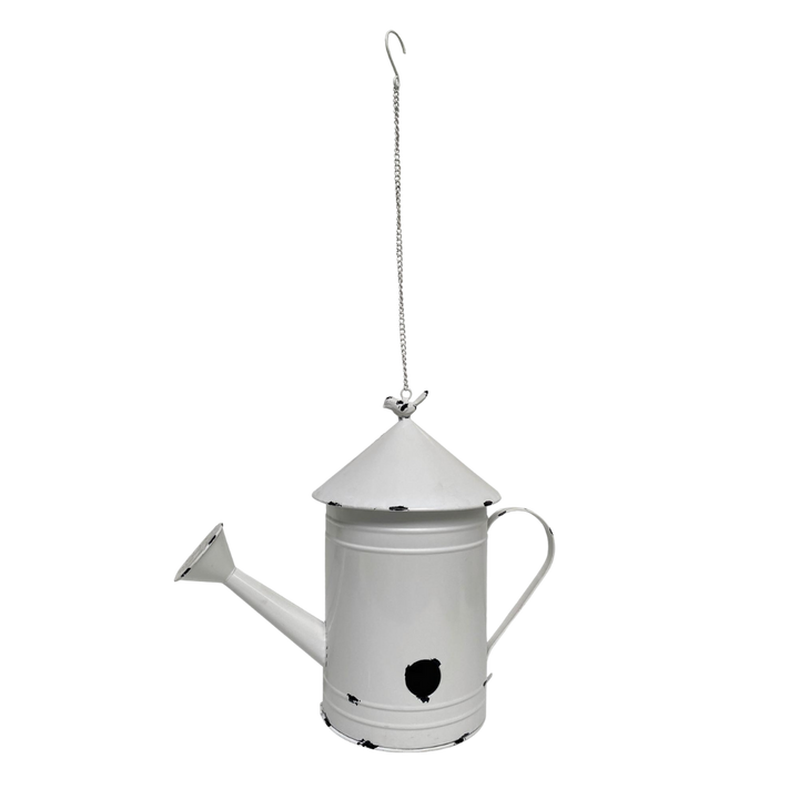 Metal birdhouse shaped like a watering can with rustic garden accents