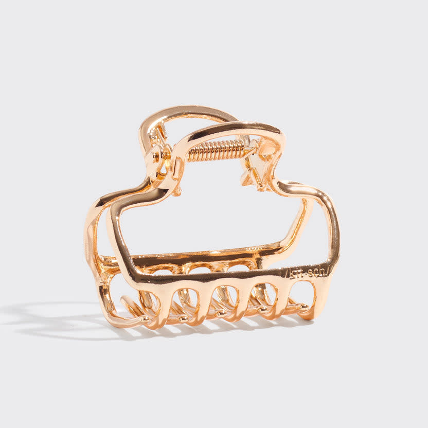 Gold metal medium open-shape puffy claw clip with subtle shine