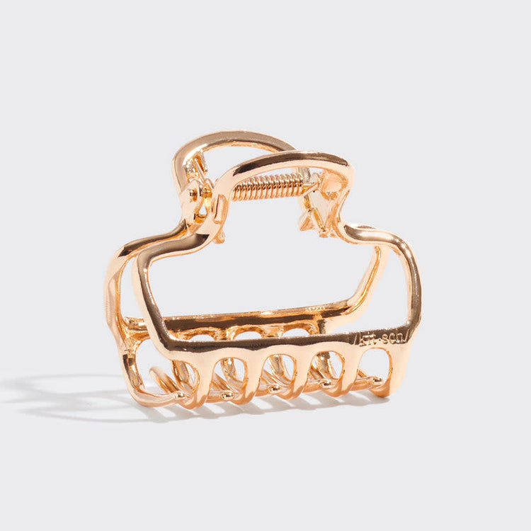 Gold metal medium open-shape puffy claw clip with subtle shine