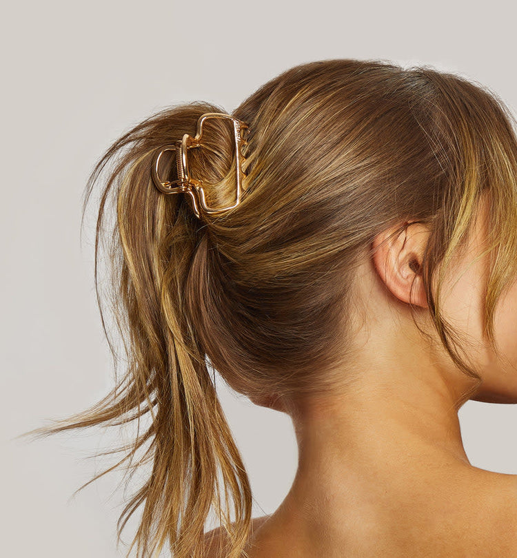 Gold metal medium open-shape puffy claw clip with subtle shine