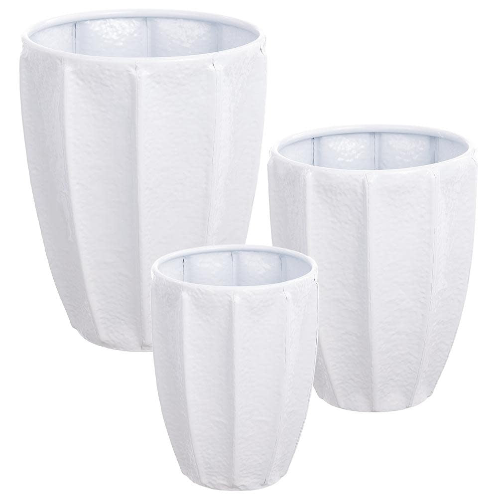 White metal planter with a cylindrical shape holding greenery