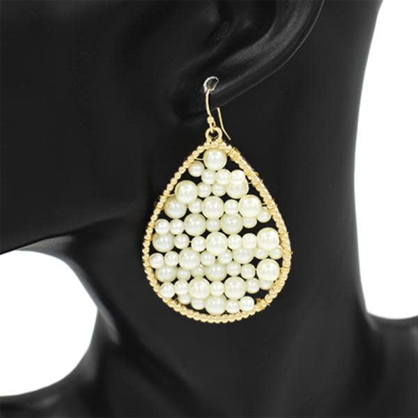Gold metal teardrop dangle earring with cream pearl accent
