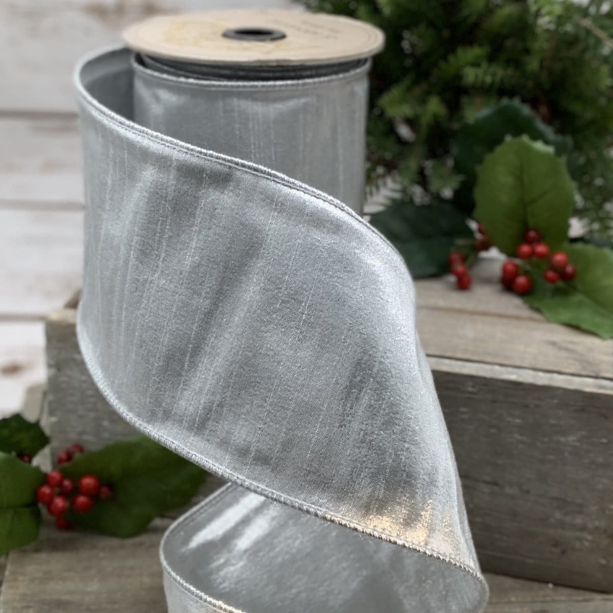 Silver-grey metallic dupion ribbon roll with a smooth satin finish.