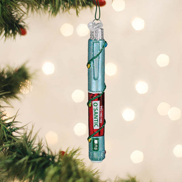 Red festive ornament shaped like a vintage insulin injection pen with white text reading Ho Ho Ho O'santic.
