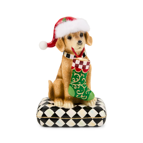 Holiday Lab dog figurine wearing a Santa hat, holding a green stocking on a checkered pillow.