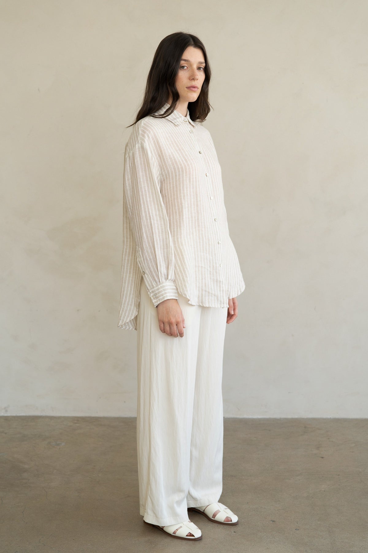 Eliana striped linen shirt in natural tone with relaxed straight cut, pointed collar, and full button front.