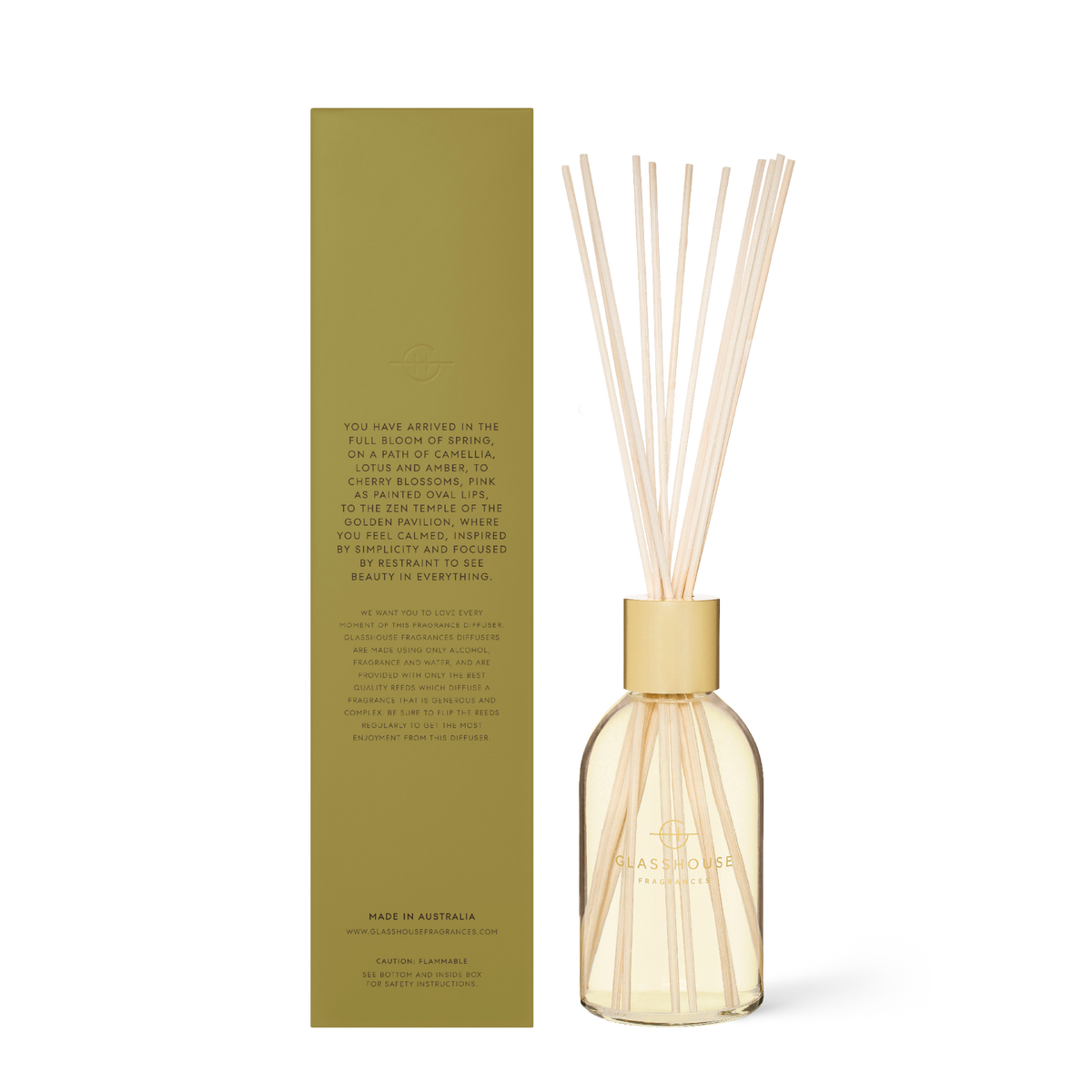 Kyoto In Bloom diffuser bottle with amber liquid, white cap, and reeds.