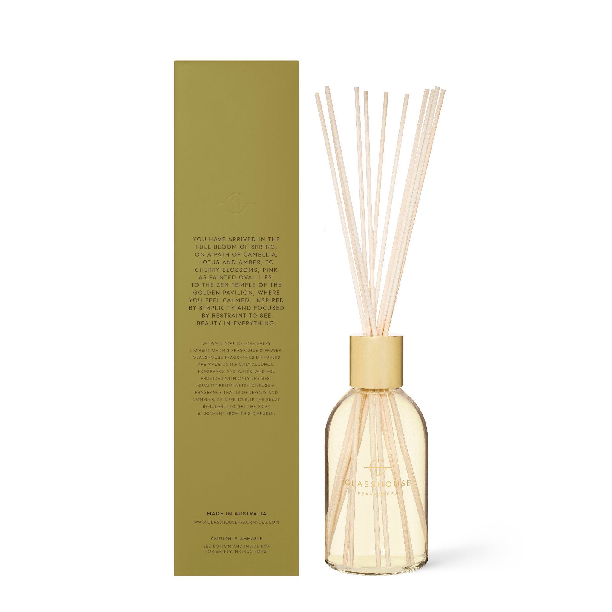 Kyoto In Bloom diffuser bottle with amber liquid, white cap, and reeds.