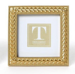 Square gold photo frame with an intricate laurel wreath design and beaded inner border.