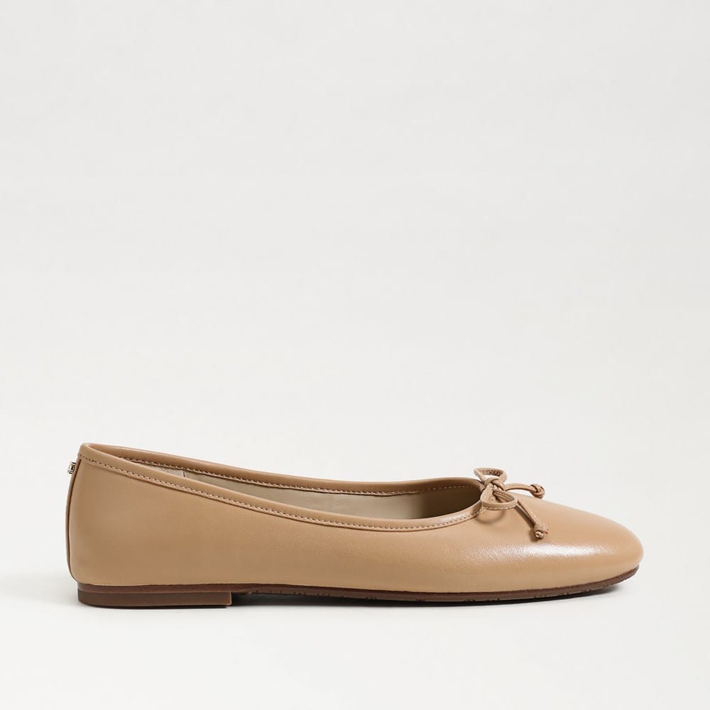 Tan leather Alie Ballet Flat with a round toe and a small bow detail on the front.