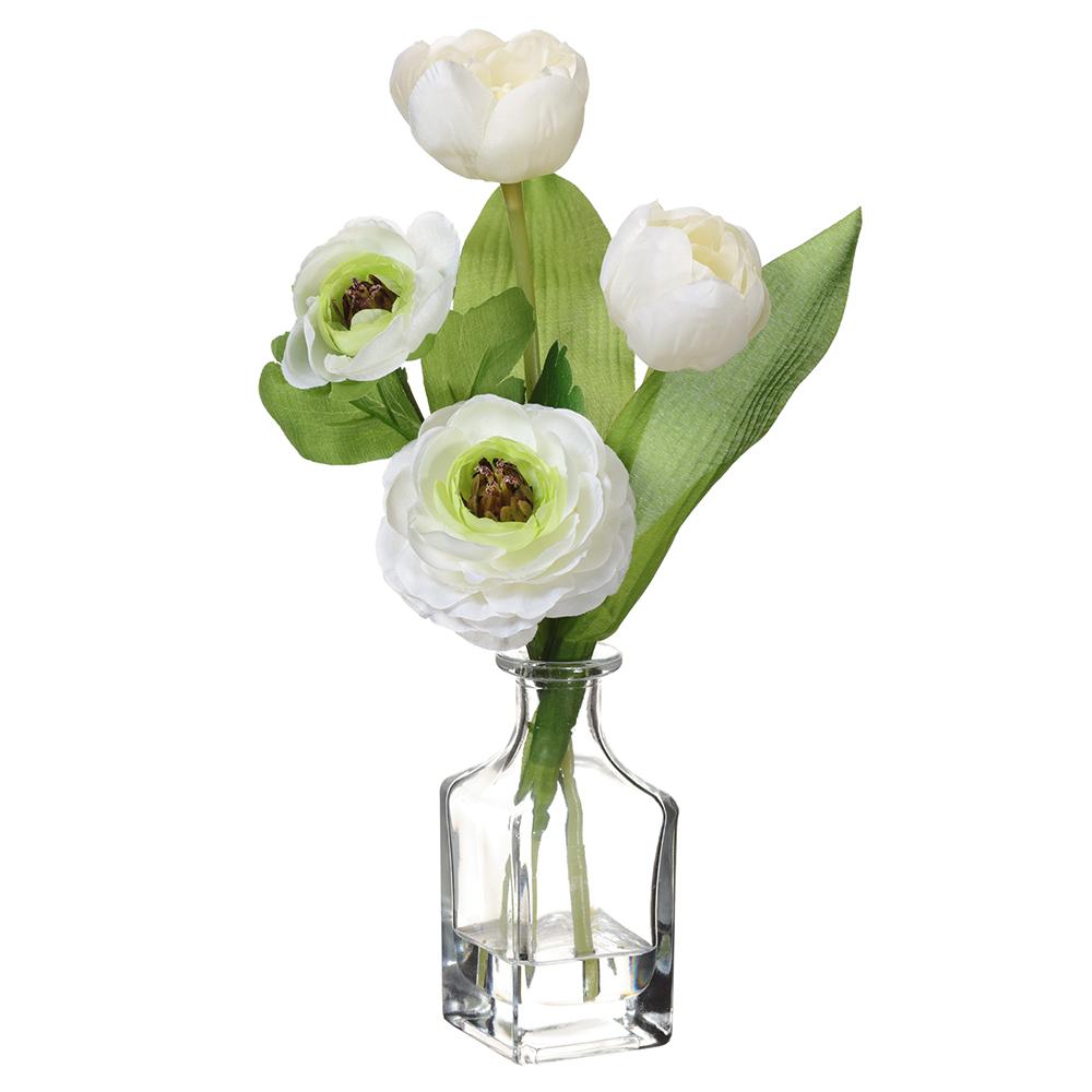 White ranunculus flowers in a clear glass vase with wire support