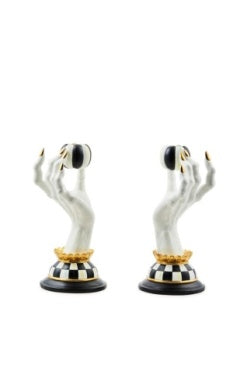 Spooky haunted house candle holder with black silhouette and window cutouts